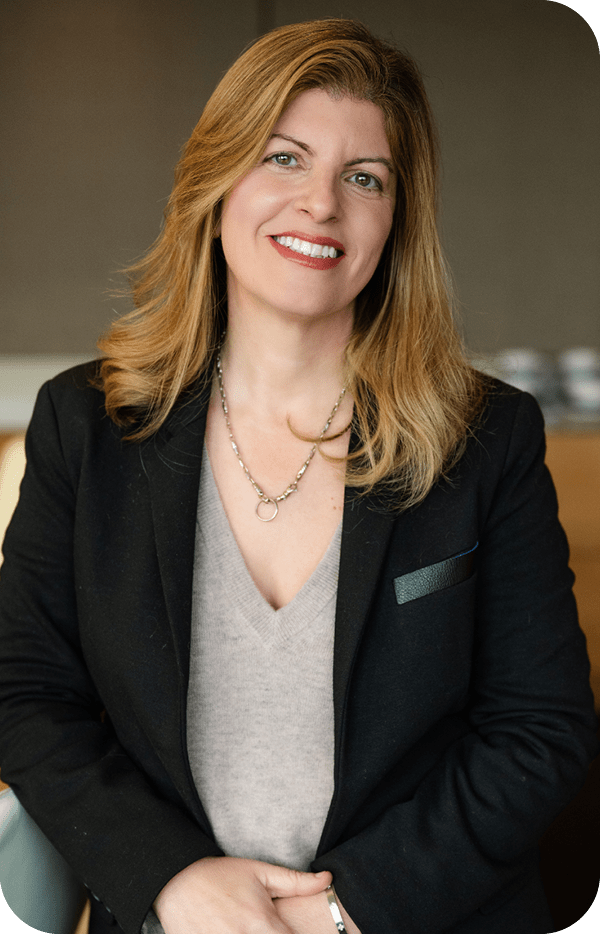 A woman in a suit and tie is smiling for the camera. AI generated content