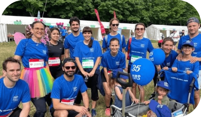 A group of people wearing blue shirts and holding signs pose for a picture. AI generated content